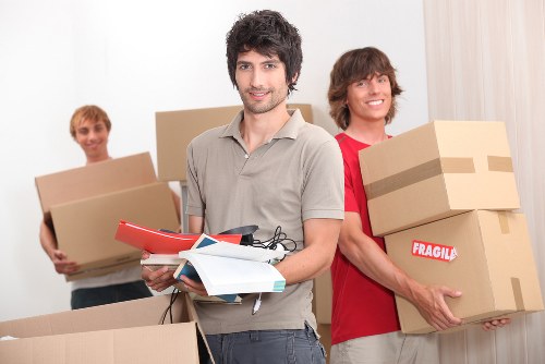 Local removal van helping customers move furniture in Watford