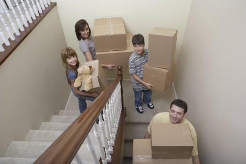 Professional movers handling boxes and furniture for a Watford relocation